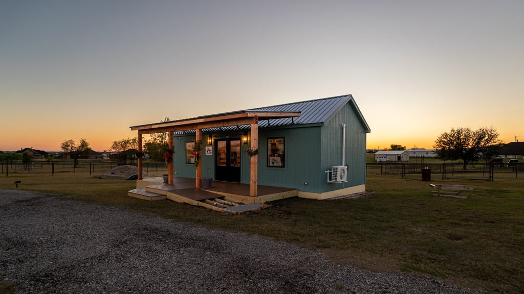 The finished cabin shell set and levelled on the Allisons' property near Sanger, Texas