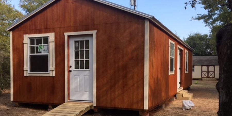 brown cabin barn with white door